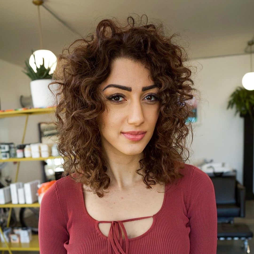 Mid-Length Curly Hairstyle For Long Faces